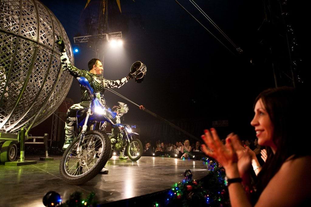 Stunt riders showcase their tricks for the Red Ball audience.